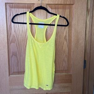 (2) tank tops; Women’s small, yellow and orange, Hollister tops, good condition.